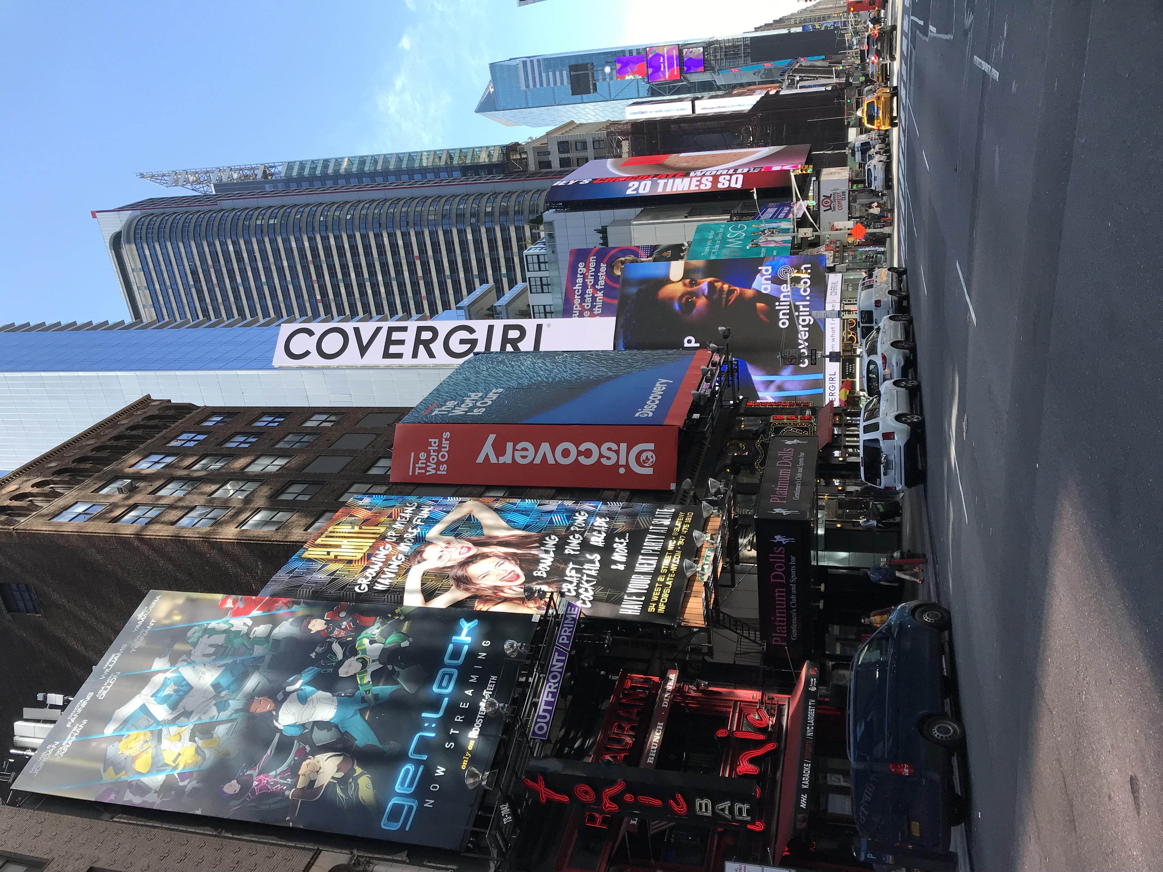 Midtown Manhattan streetscape, towers, and digital billboards